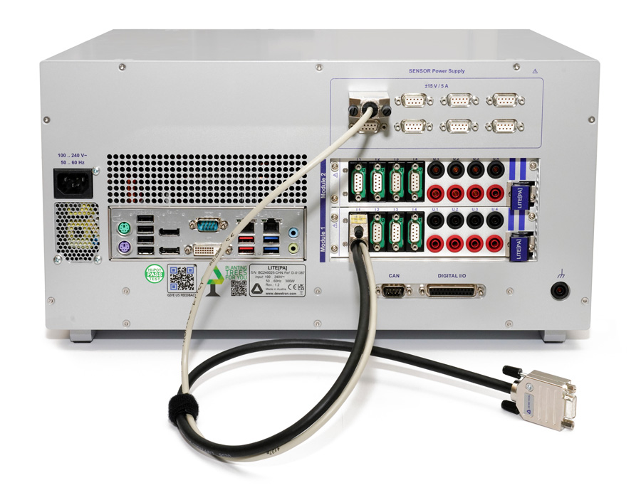 Rear view of a litepa turnkey Power Analyzer laboratory device showing multiple ports, connectors, and sockets, including serial, USB, Ethernet, and power supply inputs. One cable is connected to a port, and another lies in front.